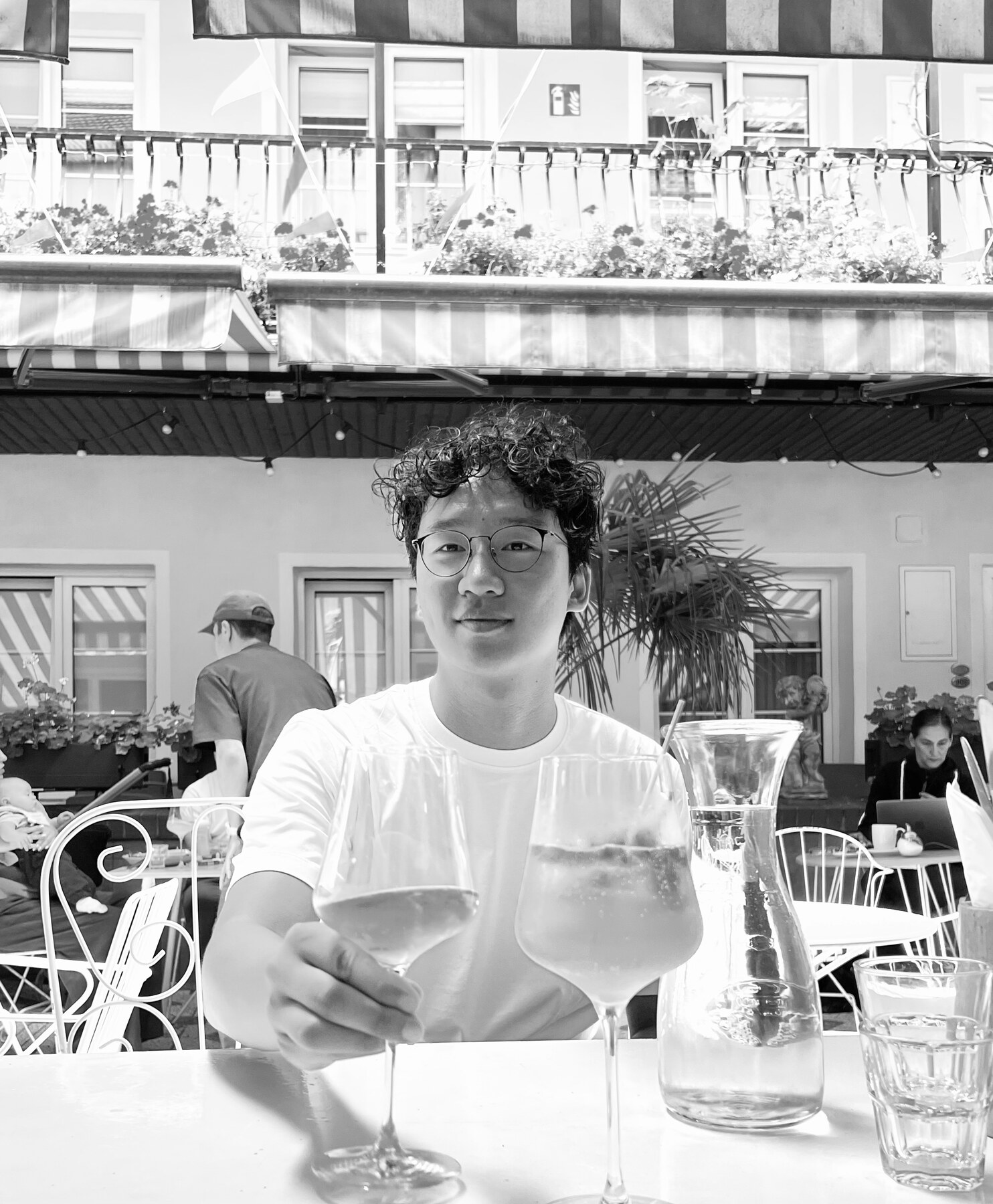 Dowon Kim seated at an outdoor café
